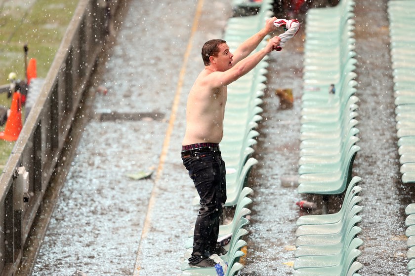 Some fans braved the elements during the pause in proceedings.