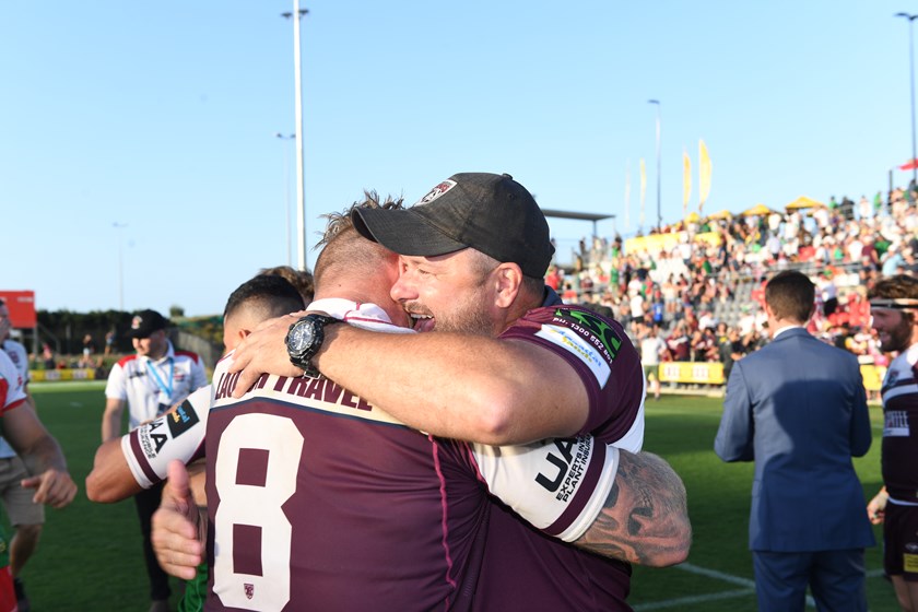Jim Lenihan celebrates winning a grand final with Burleigh Bears captain Luke Page in 2019.