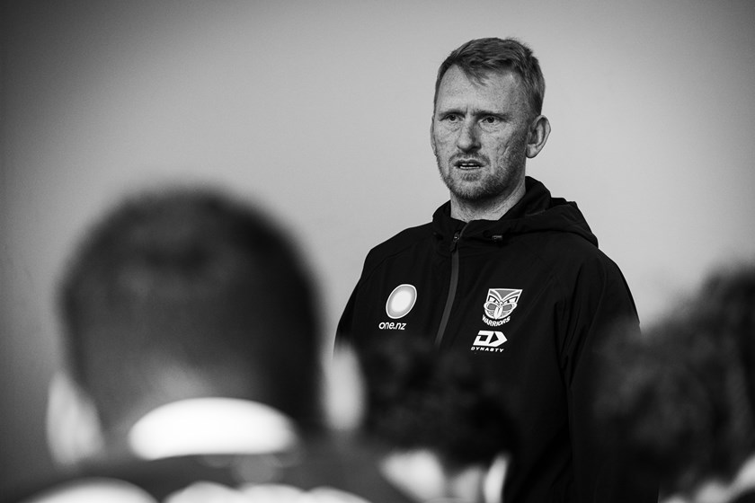 Warriors coach Andrew Webster addresses a group of young players.